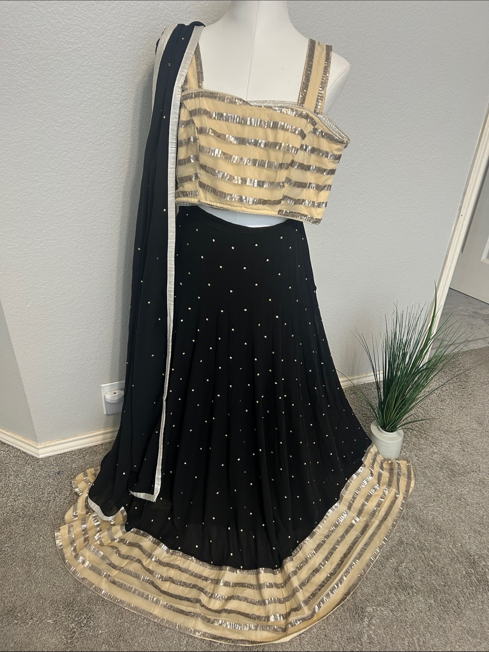 Black lehenga Skirt blouse in lite gold sequins on net. Black duppatta. Size. S
